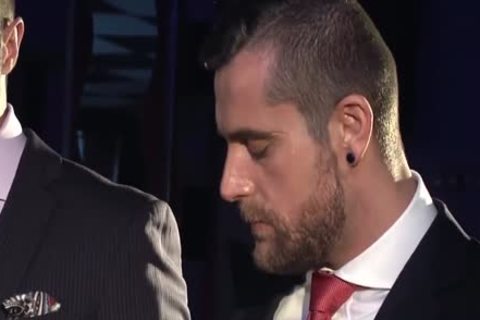 Two teens In Suits Meet In A Bar